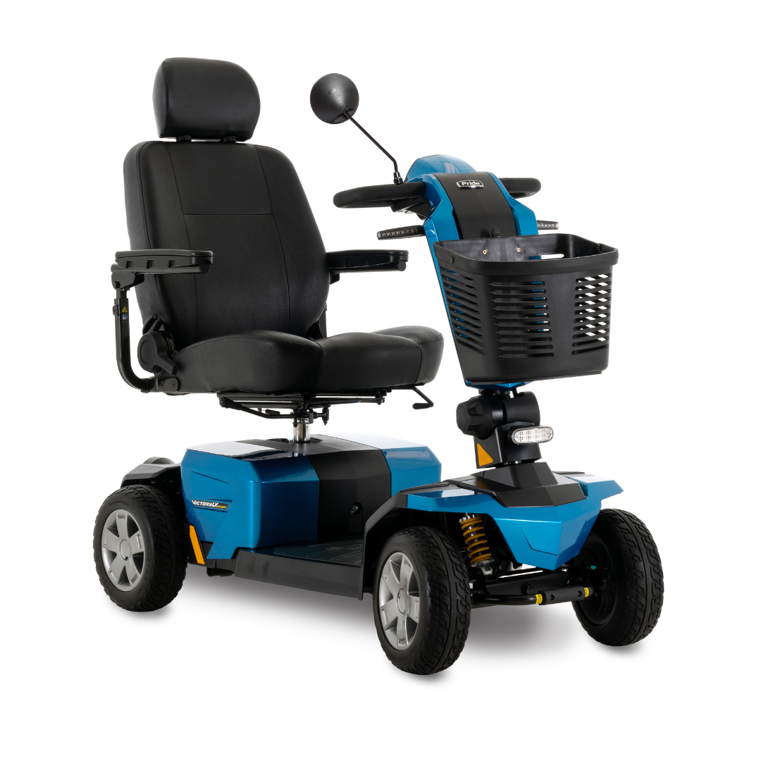 The Pride Mobility Victory LX Sport Scooter features four wheels, a blue frame, black cushioned seat with armrests, front basket, and handlebars with a mirror—ideal for anyone seeking comfort and style in a mobility scooter.